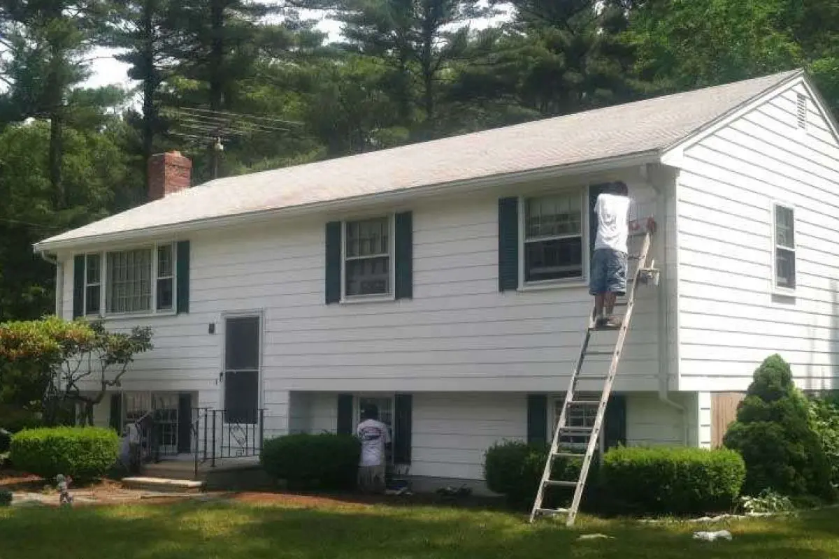 A photo of a home exterior being painted and updated by Liberty Painting.