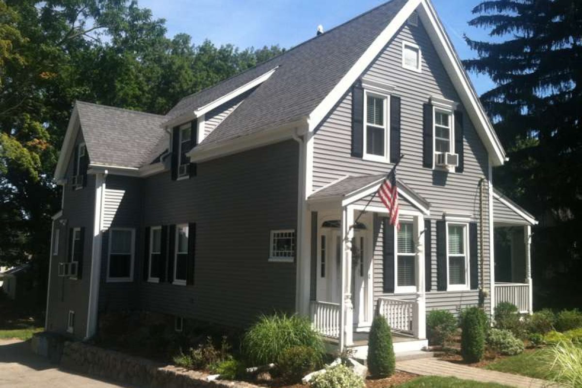 A photo of a home in Braintree, MA after the exterior was updated by Liberty Painting.