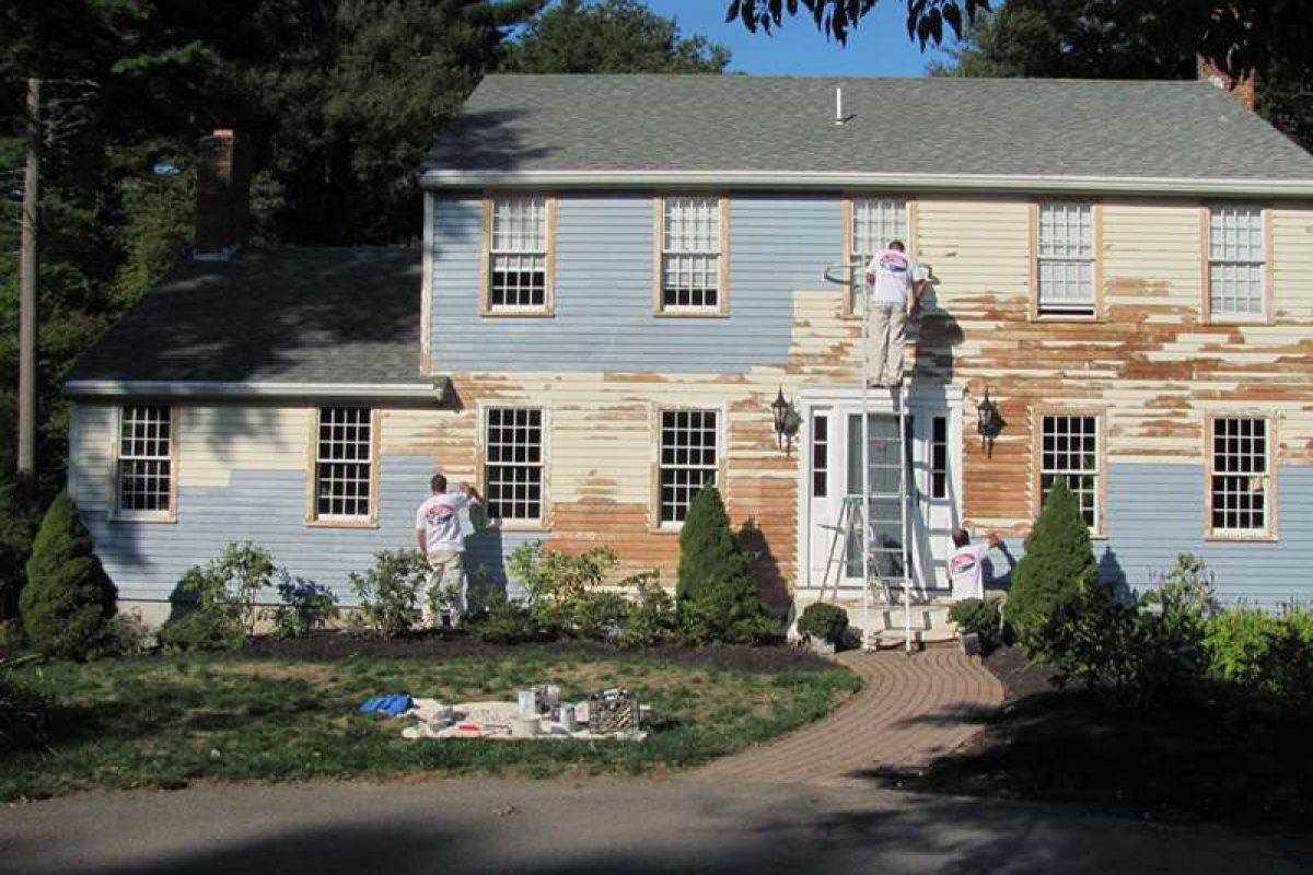 A photo taken during the project on a home in Hingham while the exterior was being updated by Liberty Painting.