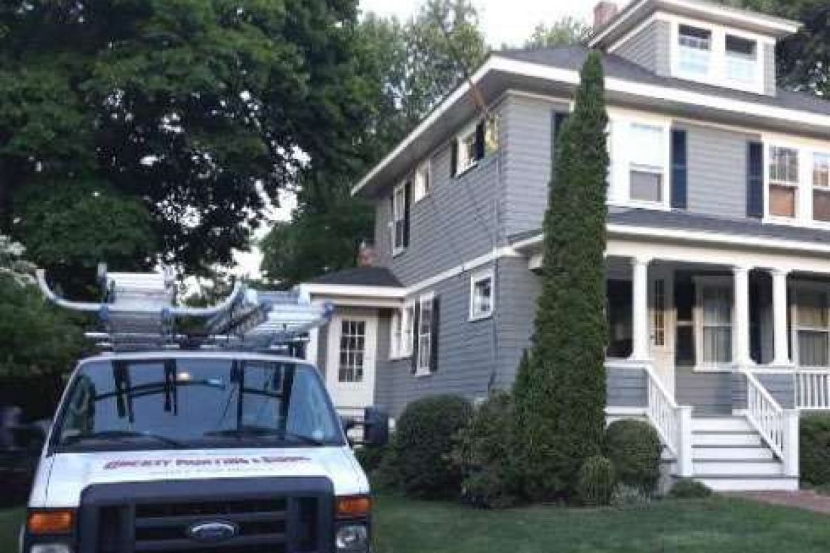 After photo of a home in Braintree that had its exterior painted to a sophisticated soft blue-gray by Liberty Painting.