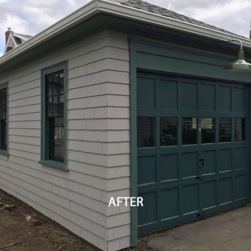 An after photo of a Quincy Garage and the much needed update it needed to its worn exterior by Liberty Painting.