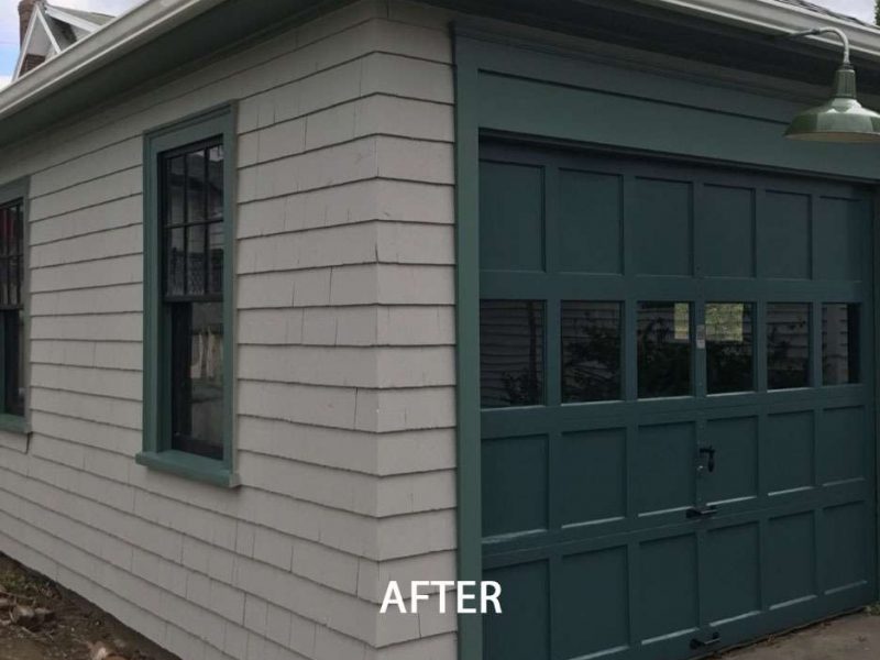 An after photo of a Quincy Garage and the much needed update it needed to its worn exterior by Liberty Painting.