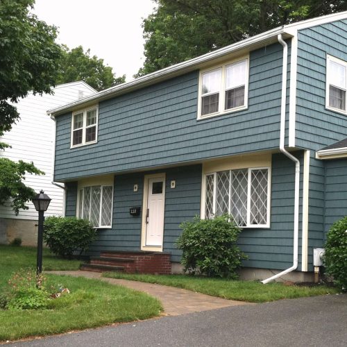 A photo of a finished project updating the siding on a home in Milton.