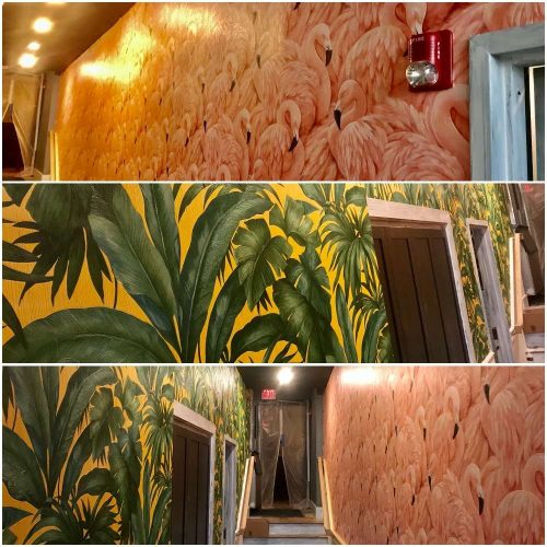 A photo of expertly applied tropical and flamingo patterned wallpaper by Liberty Painting.