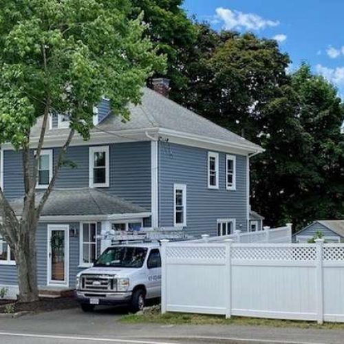 An after photo of new siding on a house in Canton, MA - second angle