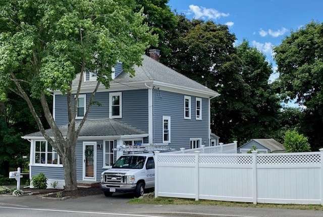 An after photo of new siding on a house in Canton, MA - second angle