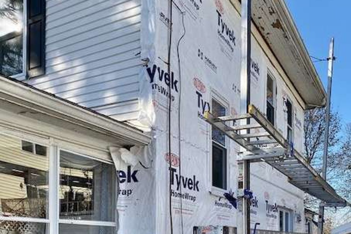 A photo taken during the project on a house in Canton, MA which needed new siding.