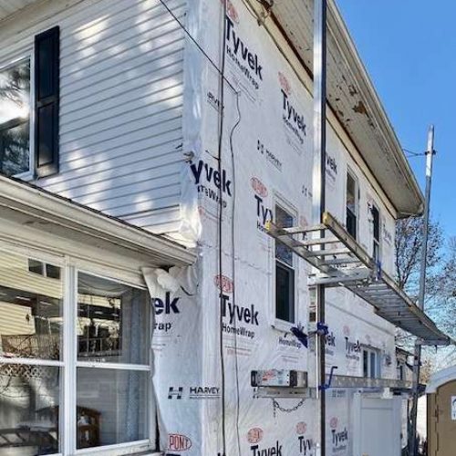 A photo taken during the project on a house in Canton, MA which needed new siding.