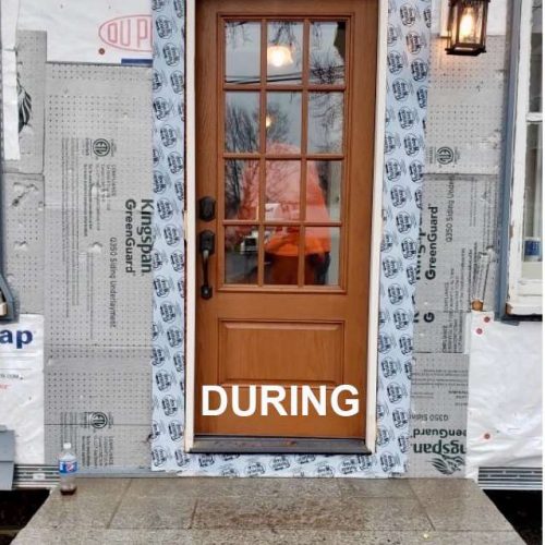 A photo taken during the door installation of a new door in Canton, MA by Liberty Painting.